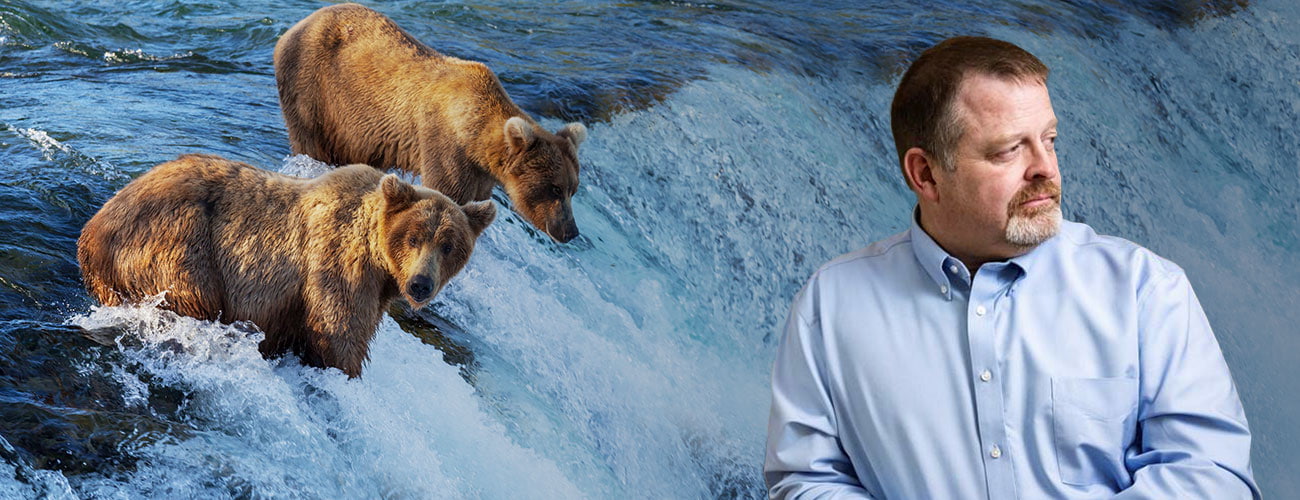 Hero Banner - Attorney Profile Picture over a photo of two bears eating salmon in a river